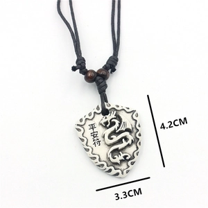 Vintage dragon shield pendant necklace with white resin relief and black cord