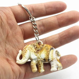 Ethnic style elephant keychain with carved resin pendant on silver metal ring and chain