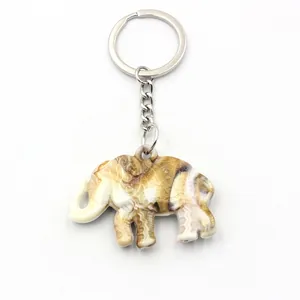 Ethnic elephant keychain with carved resin pendant and silver metal ring chain
