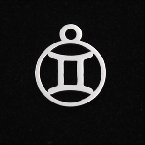Detailed view of silver stainless steel Gemini zodiac charm pendant with hollow design