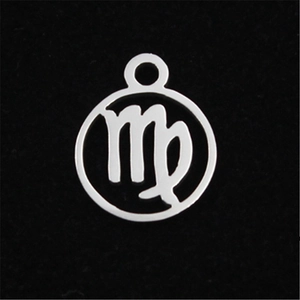 Macro detail of Virgo zodiac charm with hollow design and silver stainless steel finish