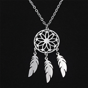 Elegant stainless steel dreamcatcher necklace with delicate feather pendants on a black base