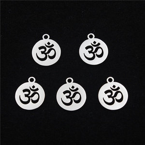 Five-piece stainless steel Om pendant set with hollow religious symbols on black velvet background