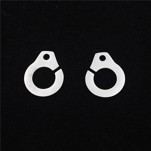 Polished stainless steel handcuff pendants for DIY jewelry making on black background