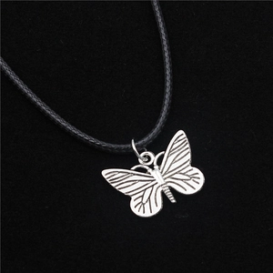 Silver butterfly pendant necklace with detailed texture on black braided cord