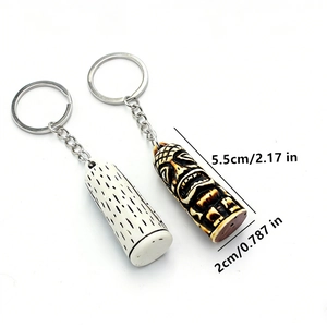 Detailed view of resin Tiki keychain pendants with dimensions of 5.5cm by 2.0cm