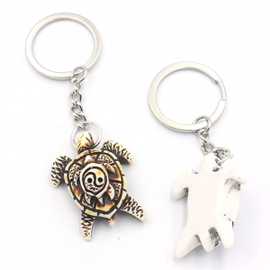 Turtle keychain set with resin yin-yang sea turtle carving and silver metal ring
