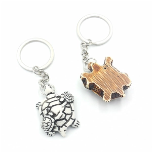 Turtle resin keychain featuring hand-painted shell patterns with silver metal rings