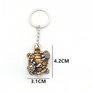 Resin sea turtle keychain featuring mother and baby turtles in vintage bone-color finish