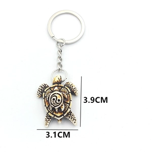 Lucky turtle keychain with resin yin yang pattern and vintage engraved shell detail