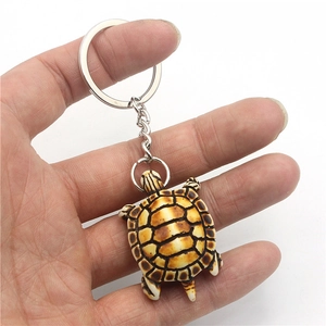Handheld realistic sea turtle keychain made of resin with vintage brown shell and silver ring