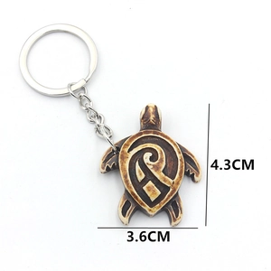 Ocean sea turtle keychain in antique brown resin for backpacks and bags, 4.3cm long