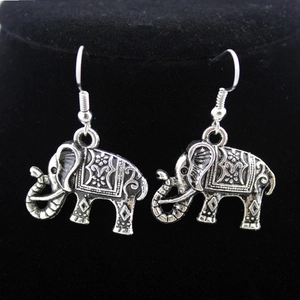 Bohemian antique silver elephant drop earrings with detailed floral embossed patterns