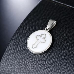 Polished stainless steel round pendant featuring an Orthodox cross with white shell inlay