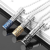 Detail of hollow cylinder pendants with only engraving in blue gold and black steel