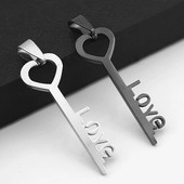 Detail of silver and black key pendants with hollow heart handles and LOVE shaped teeth