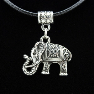 Antique silver elephant pendant necklace with ethnic patterns on a black cord