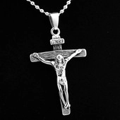 Macro shot of silver stainless steel crucifix pendant with INRI engraving on ball chain