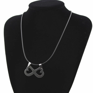 Detailed shot of double heart infinity symbol pendant on durable black cord