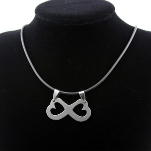 Infinity heart symbol stainless steel pendant necklace on black display stand