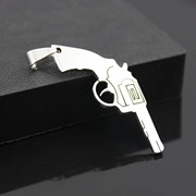 Detailed view of punk style revolver pistol pendant with metallic finish and large bail