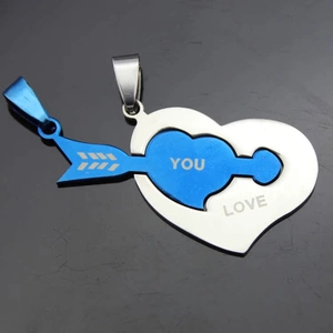 Detail of interlocking stainless steel couple necklace with Love You heart and arrow design