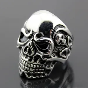 Macro detail of gothic punk skull ring in silver-tone stainless steel with blackened accents