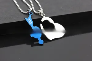 Detail shot of blue arrow and silver heart pendant set with LOVE YOU engraving