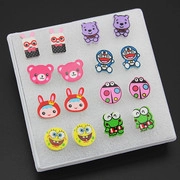 Detailed set of 12 pairs of colorful cartoon stud earrings displayed on a white foam board