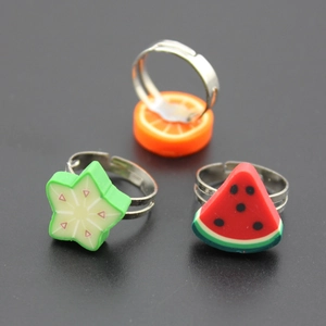 Adjustable cartoon fruit ring set with orange, watermelon, and star shapes for children