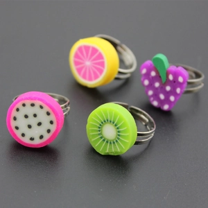 Adjustable fruit rings for kids featuring dragon fruit, lemon, kiwi, and grape designs