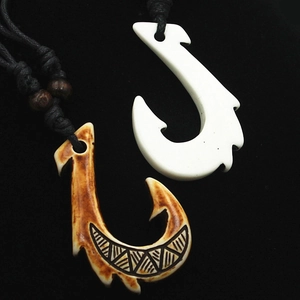 Maori style resin fish hook necklaces with tribal carvings and black woven cords