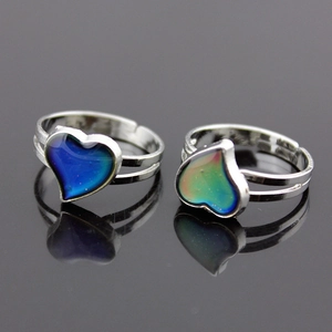Adjustable silver heart mood ring showing temperature-dependent color change effects