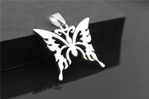 Close-up of gothic butterfly pendant with hollow design and thorny metal wings