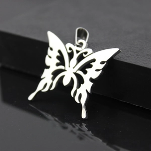 Polished stainless steel butterfly pendant with hollow totem design on black mirror surface