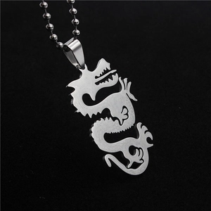Polished stainless steel dragon necklace with hollow carved details and ball chain link