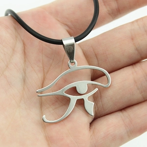 Polished stainless steel Eye of Horus pendant on black cord shown in hand