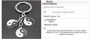 Detail of silver alloy keychain featuring three black and white Yin Yang enamel pendants