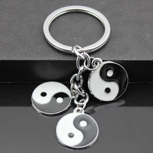 Yin Yang Tai Chi metal keychain featuring three enamel pendants on a silver ring