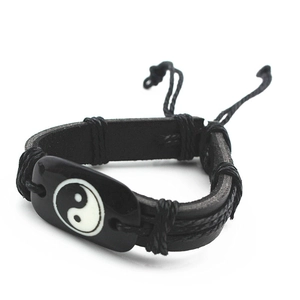 Handmade punk style leather woven bracelet featuring a Tai Chi Yin Yang symbol charm