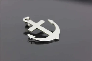 Polished silver stainless steel anchor and cross pendant shown from a top-side perspective