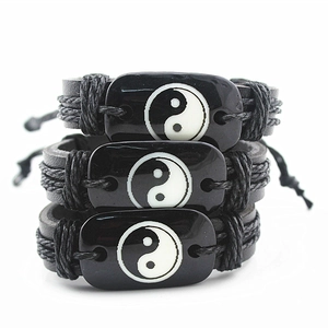 Set of three handmade woven Tai Chi Yin Yang bracelets with polished black resin charms