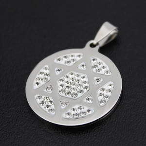 Macro shot of silver stainless steel Star of David pendant with shimmering crystal inlay