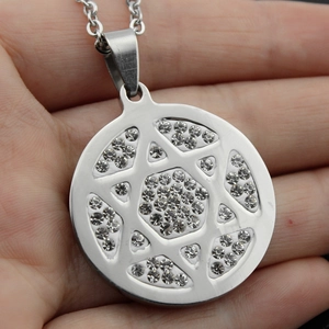 Titanium steel hexagonal star pendant necklace with white rhinestones on hand
