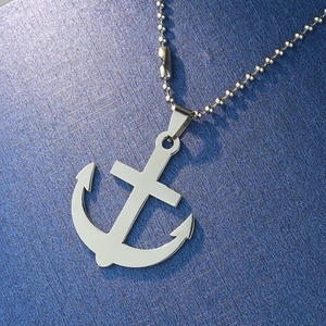Polished stainless steel anchor pendant necklace with bead chain on a blue background