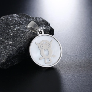 Fashionable stainless steel owl pendant necklace with rainbow shell inlay on dark rock