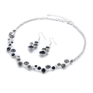 Parure de bijoux en alliage argenté avec pendentifs ronds émaillés noir et gris étoilé