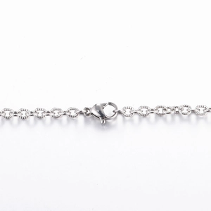Detail of silver stainless steel O-chain with embossed texture and lobster clasp