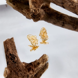 Exquisite 14k gold plated brass butterfly earrings with hollow zircon wings on wood