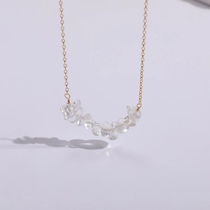 Minimalist 14K gold plated necklace featuring irregular natural white crystal stones